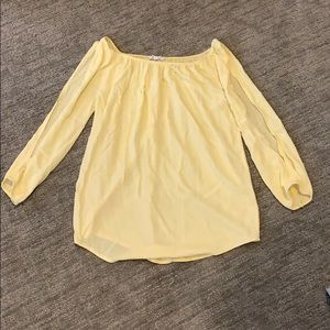 Long sleeve off the shoulder shirt.